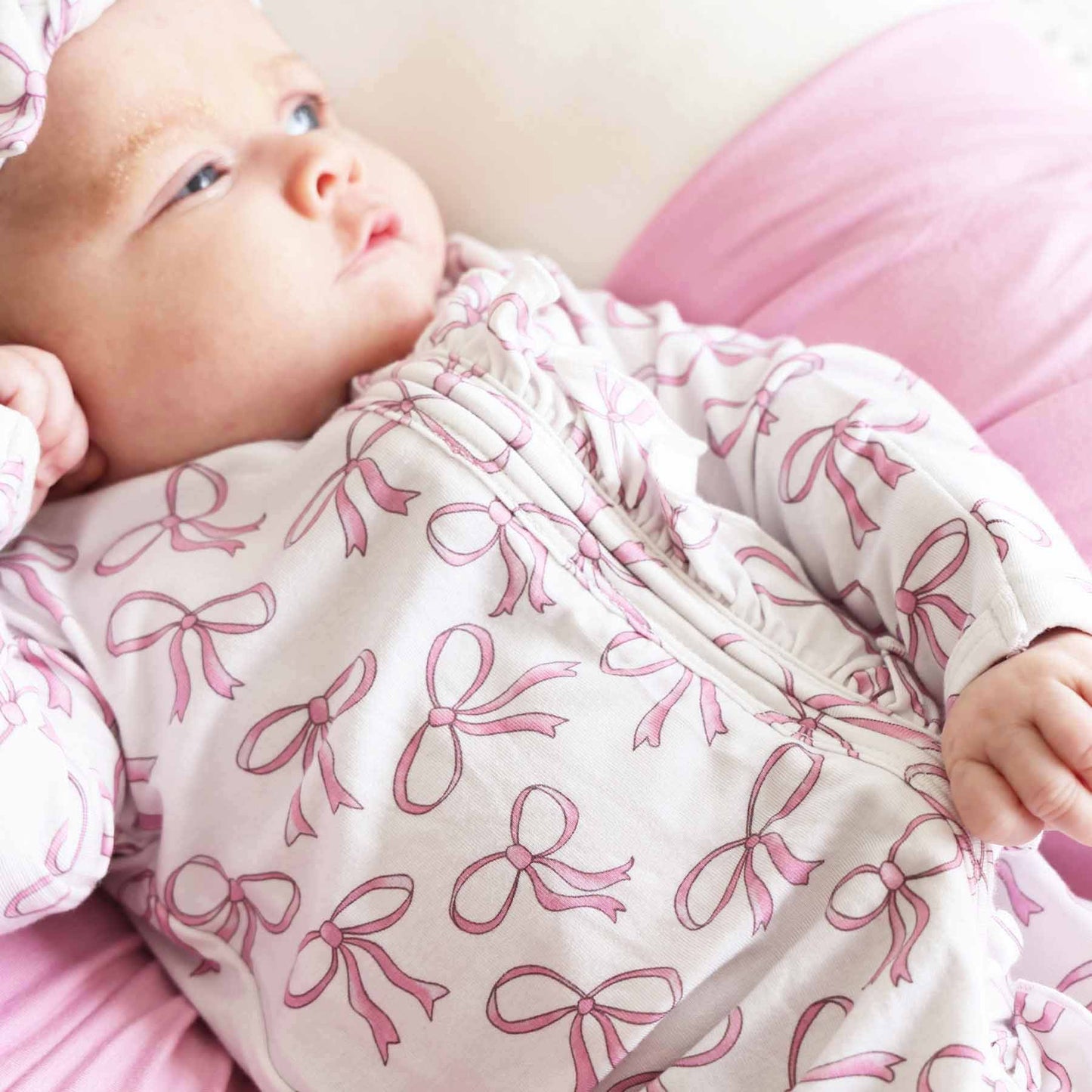 Blushing Bows Ruffle Zipper Footie