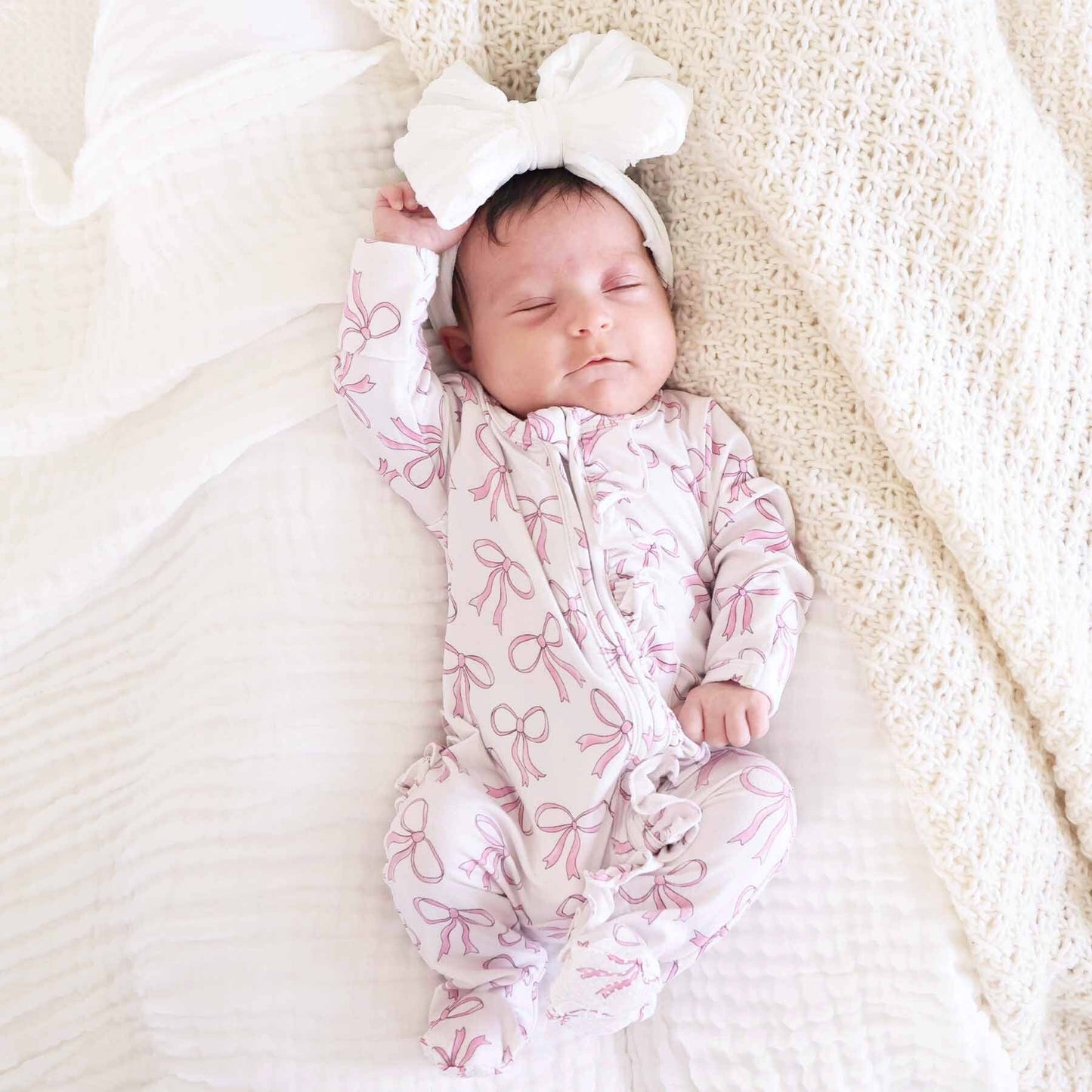 Blushing Bows Ruffle Zipper Footie